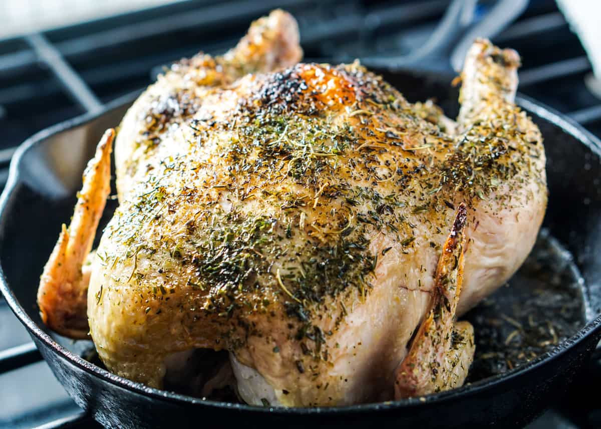 Simple Whole Roasted Herb Chicken Recipe - Just 5 minutes of active time and 1 hour baking for this clean eating head-to-toe recipe