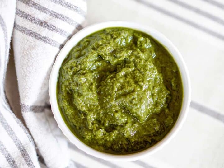 This Awesome Kale Green Sauce recipe is packed with delicious nutritious greens. 5 ingredients, 5 minutes. Use for a healthy kick on Pizza, Salads, + fries.