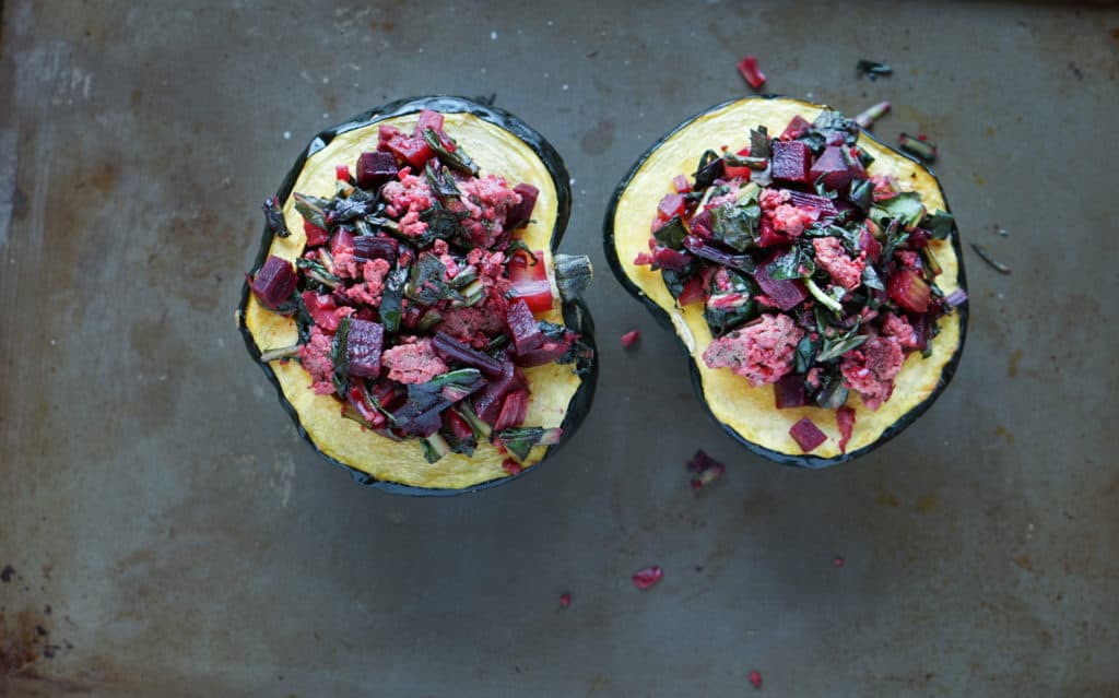 A healthy paleo and whole 30 friendly dinner idea: Beet, Dandelion and Grass-Fed Beef Stuffed Acorn Squash recipe full of protein,vegetables and greens