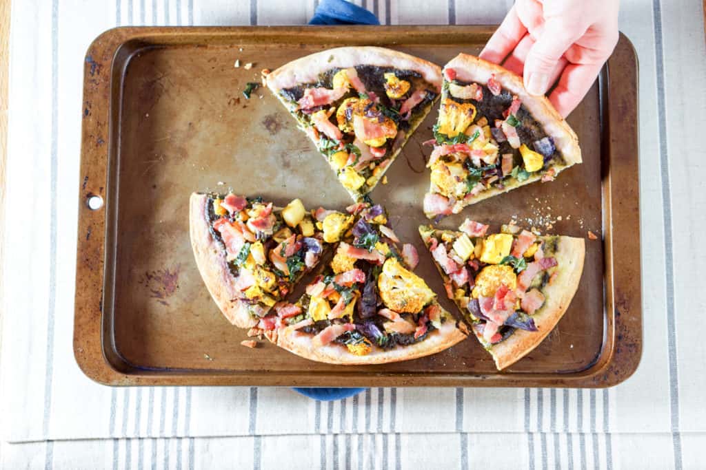 This Roasted Cauliflower and Kale Sauce Flatbread Recipe is a completely reinvented look at pizza: gluten free crust, nightshade free sauce, and dairy free.