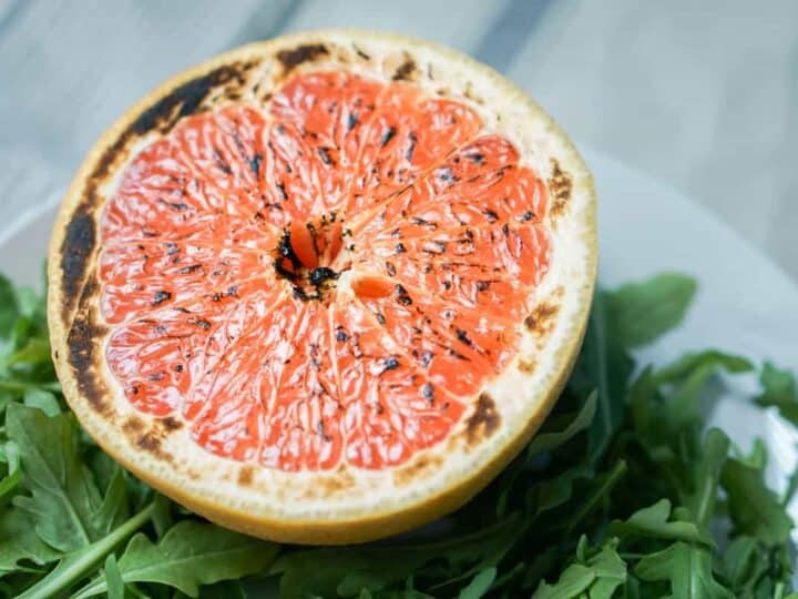 This brûléed grapefruit recipe showcases caramelized sugars without added refined sugars and cream. Add tossed arugula for a paleo, whole 30, GF, DF lunch.