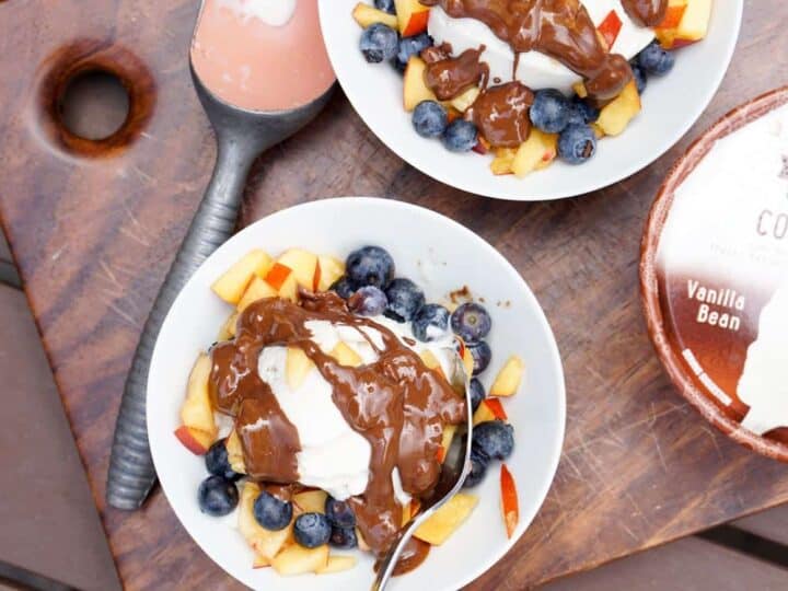 Fresh berries, creamy coconut ice cream, healthy magic shell make this great dairy free coconut berry sundae with homemade peanut butter chocolate drizzle