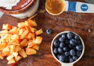 Fresh berries, creamy coconut ice cream, healthy magic shell make this great dairy free coconut berry sundae with homemade peanut butter chocolate drizzle