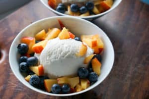 Fresh berries, creamy coconut ice cream, healthy magic shell make this great dairy free coconut berry sundae with homemade peanut butter chocolate drizzle