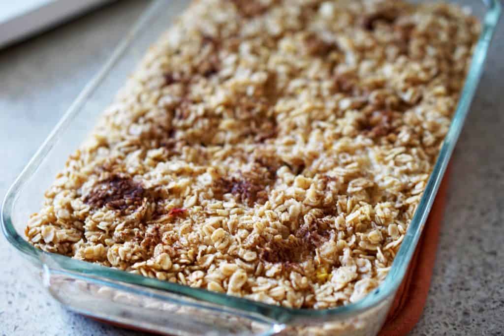 This easy egg alternative will save time in the mornings. Gluten free, dairy free, refined sugar free, paleo and vegan healthy baked oatmeal made with peaches and rhubarb recipe with just enough cinnamon and nutmeg.