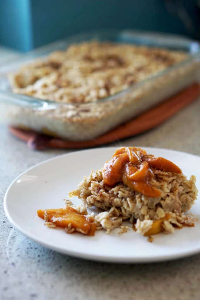 This easy egg alternative will save time in the mornings. Gluten free, dairy free, refined sugar free, paleo and vegan healthy baked oatmeal made with peaches and rhubarb recipe with just enough cinnamon and nutmeg.