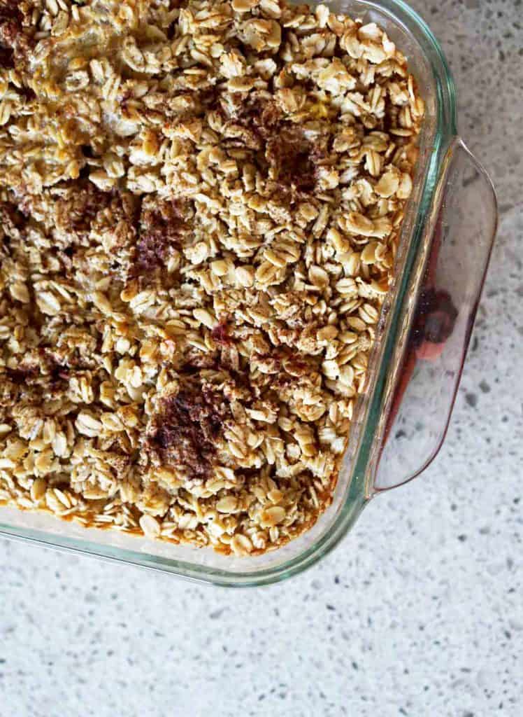 This easy egg alternative will save time in the mornings. Gluten free, dairy free, refined sugar free, paleo and vegan healthy baked oatmeal made with peaches and rhubarb recipe with just enough cinnamon and nutmeg.