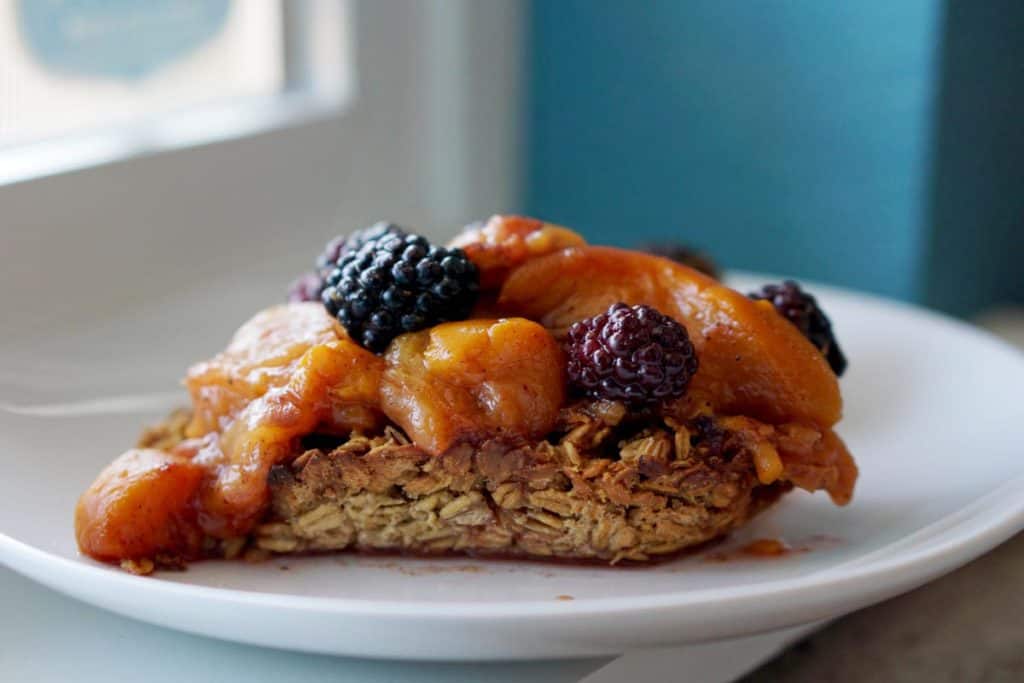 This easy egg alternative will save time in the mornings. Gluten free, dairy free, refined sugar free, paleo and vegan healthy baked oatmeal made with peaches and rhubarb recipe with just enough cinnamon and nutmeg.