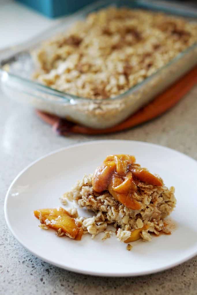 This easy egg alternative will save time in the mornings. Gluten free, dairy free, refined sugar free, paleo and vegan healthy baked oatmeal made with peaches and rhubarb recipe with just enough cinnamon and nutmeg.