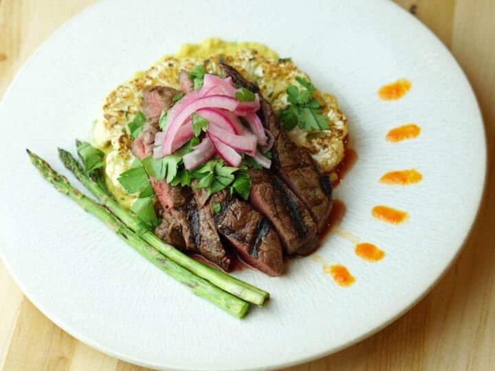 The Deconstructed Steak Taco on Curried Cauliflower Steak recipe merges the flavors of street tacos with Asian cuisine and the traditional steak house: Latin fusion that's healthy, gluten free, grain free and dairy free.