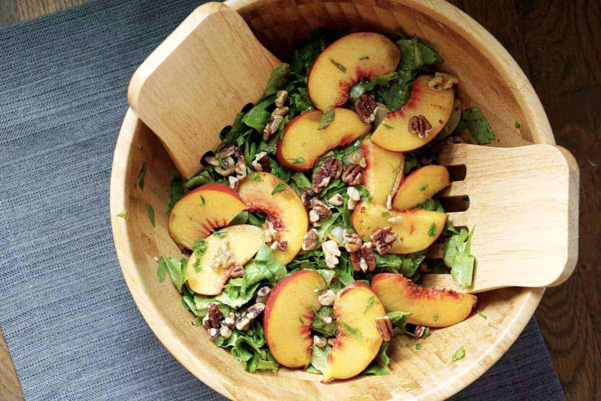 This toasted pecan, cucumber, basil, and peach salad is super fresh and incorporates summer and fall flavors into one great gluten and dairy free dish. It's also super quick and sugar-free