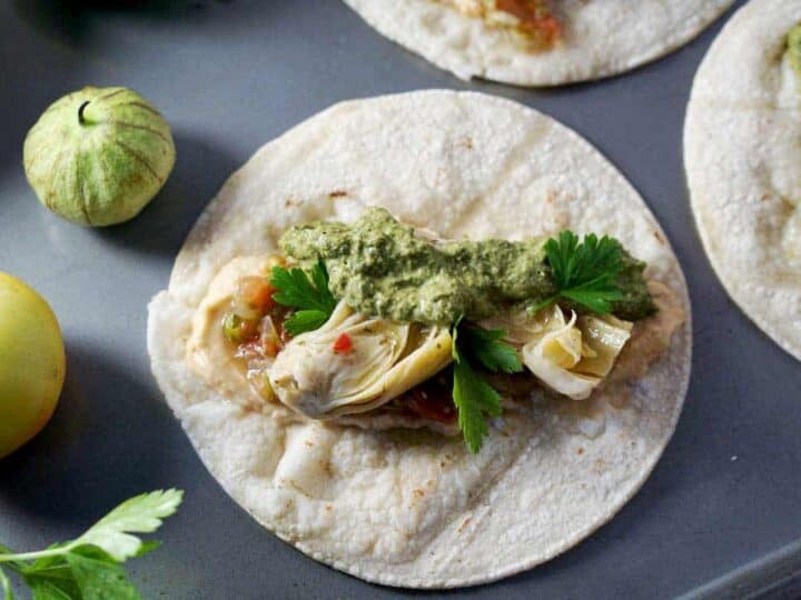 quick and easy tacos, made with hummus, salsa, and marinated artichoke hearts. Quick and easy meatless monday meal