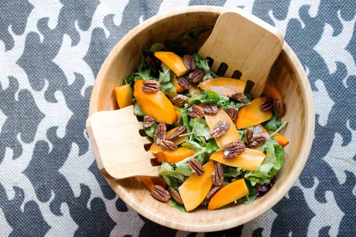This quick salad is ready in minutes and brings some freshness to classically fall flavors. Just mix persimmons, arugula, toasted pecans and spice together for a naturally paleo and gluten free salad.
