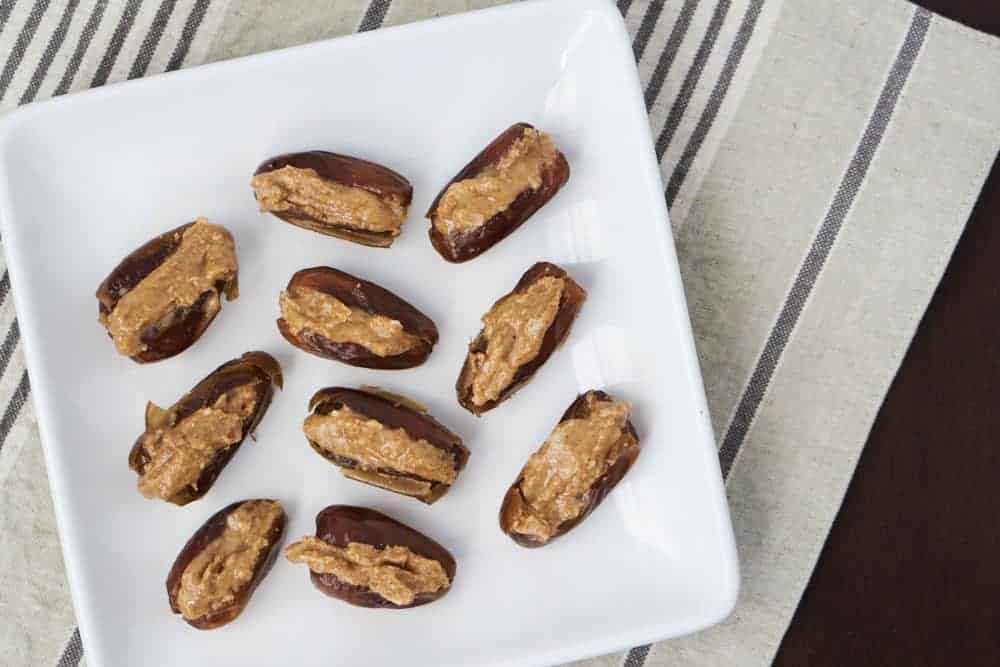 Almond coconut date bombs are a simple fat bomb that's high protein, high fat, and low carb. Great for the 3 pm slump to keep you nourished, balance blood sugars and regulate your hunger signals.