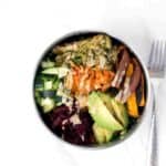 Loaded Kale Salad Bowl Recipe with Sweet potatoes, cucumbers, beets, Kimchi, tahini brocolini, avocado on tahini massaged Kale