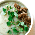 Creamy potato soup with Italian sausage and pea sprouts is savory, creamy, full of gut healing nutrients, perfect for when your craving carbs yet want to be healthy.