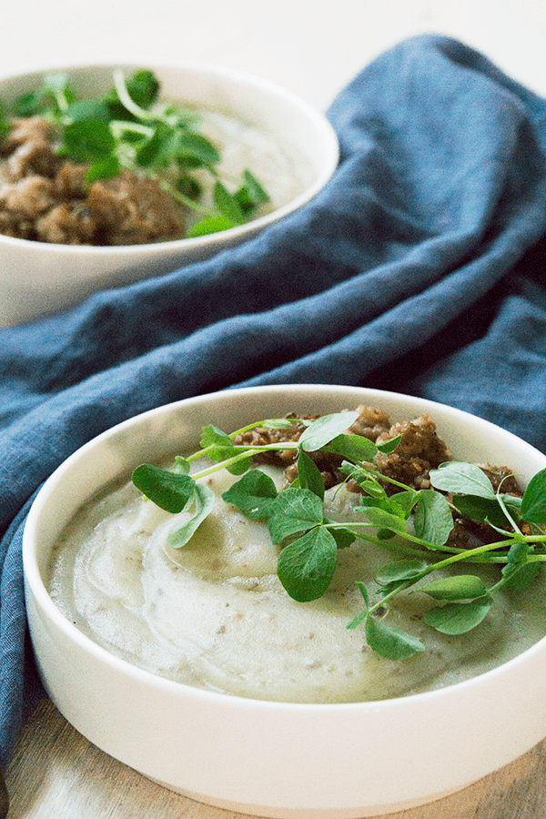 Creamy potato soup with Italian sausage and pea sprouts is savory, creamy, full of gut healing nutrients, perfect for when your craving carbs yet want to be healthy.