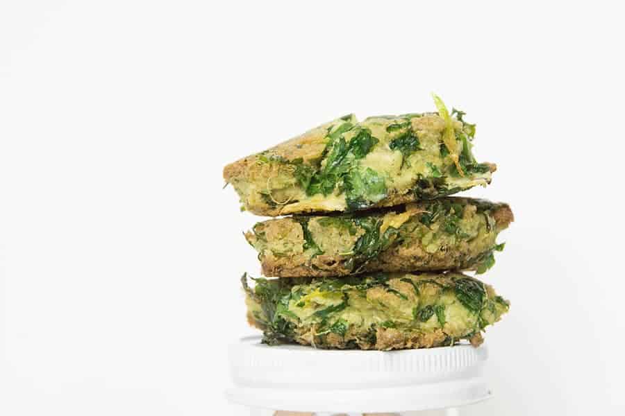 3 stacked Celery Pulp Fritters on white background
