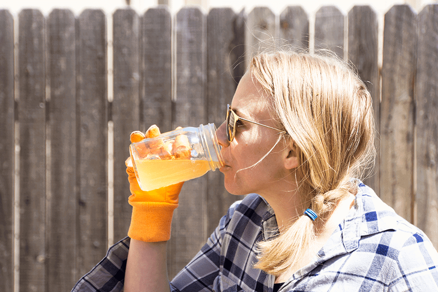 Drinking a mason jar of Home brewed Jun, a honey and green tea version of kombucha,