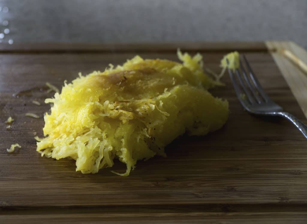 pulled spaghetti squash noodles on cutting board