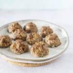 side angle of bison jicama meatballs on white plate