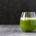 Foamy celery juice in a glass